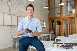 Young Stylish Smiling Man In Co Working Office, Startup Freelancer Holding Using Tablet