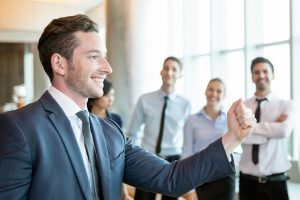 Cheerful Leader Motivating His Business Team