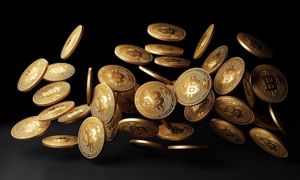 Golden Bitcoins Drop In Black Background 3d Rendering